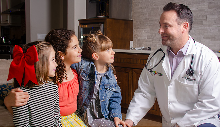 Dr. Velasco with two of his young patients